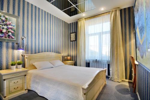 Ένα ή περισσότερα κρεβάτια σε δωμάτιο στο Aparton