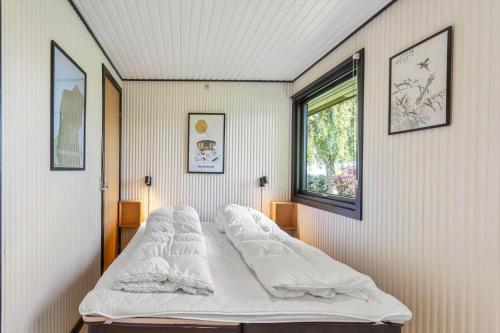 a bedroom with two beds and a window at FY348-Svendborg-Storkenaebsvej-1 in Svendborg