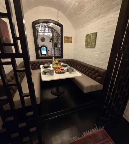 a table with food on it in a restaurant at The Ironbridge Lockup - Former Cell in Ironbridge
