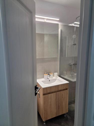 a bathroom with a sink and a mirror at Casa Mihai in Costinesti