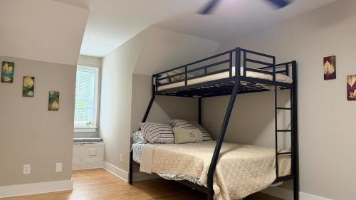 a bedroom with a bunk bed in a room at Last house on the hill in Cleveland