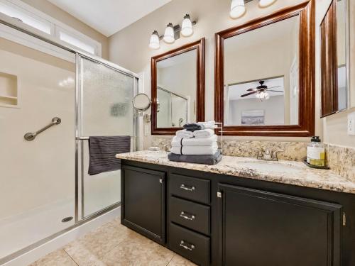 a bathroom with a sink and a shower at Amazing Grace Vacation Home in Las Vegas