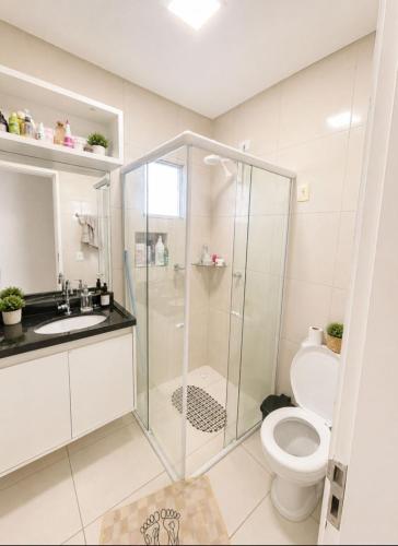 a bathroom with a shower and a toilet at Apartamento em Caruaru 3 quartos completo in Caruaru