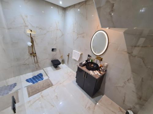 a bathroom with a sink and a mirror at DAR agafay in Lalla Takerkoust