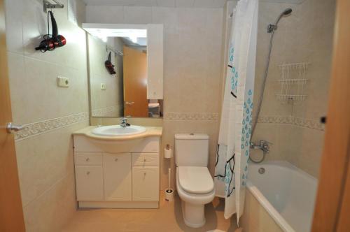 a bathroom with a toilet and a sink and a shower at Apartments-Lloretholiday-Marfull in Lloret de Mar
