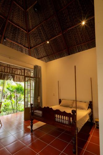 a bedroom with a bed in a room at Mango Home in Ben Tre