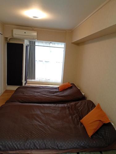 large room with 2double beds next to kuromon market