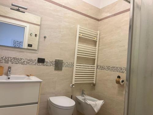 a bathroom with a toilet and a sink at Casa 2019 in Matera