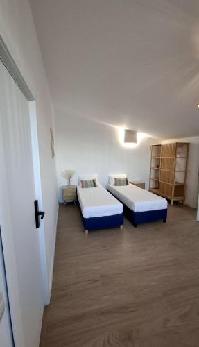 a room with two beds in a room at Maracas Sea View Boutiq in Costinesti