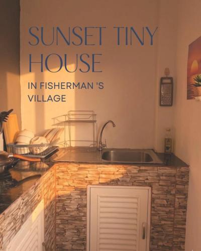 a kitchen with a sink and a sign that reads sunset tiny house at Sunset tiny house near fisherman village in Bophut