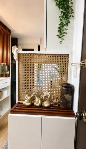 a kitchen with a counter with figurines on it at Terravive in Manila