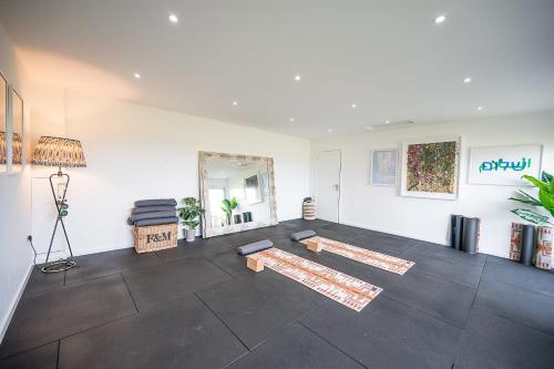 a room with two yoga mats on the floor at Toad Hall Lodges - Luxury Glamping Lodges Near Southwold! in Wangford