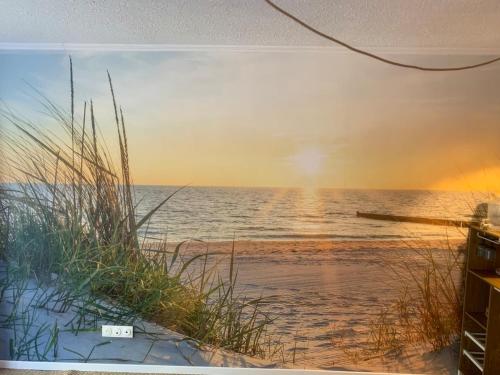 a painting of the beach at sunset at Nyons Riviera in Nyons