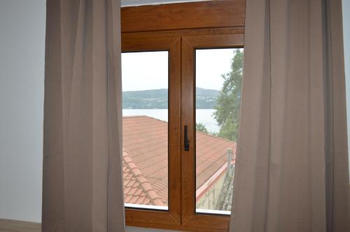 a sliding glass door with a view of a roof at D6 Lake View in Kastoria