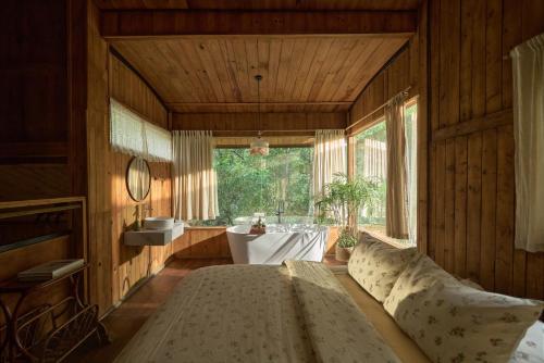 a large room with a table and a large window at Dreaming Retreat Da Lat in Ấp An Kroët