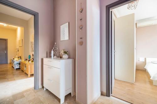 a bedroom with a white dresser and a mirror at Da Chiara in Pistoia