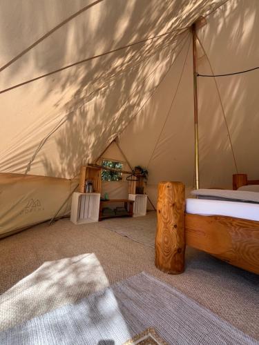 a bedroom with a bed in a tent at Hus un Köken in Börgerende-Rethwisch
