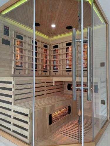 an empty sauna with a shower in a building at Villa Golden Star in Zaton