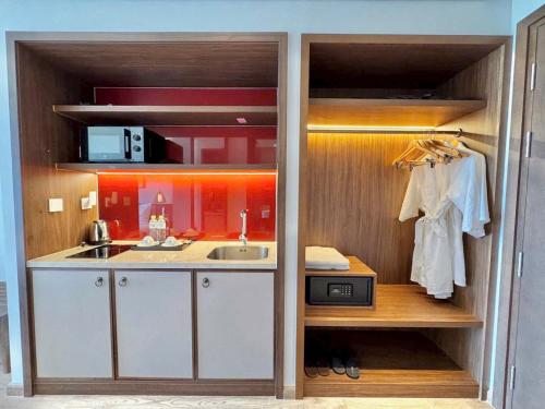a small kitchen with a sink and a sink at APEC Mandala in Mui Ne