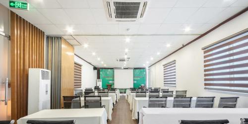 a conference room with white tables and chairs at A25 Premium Hotel - 12 Ngô Sỹ Liên in Hanoi