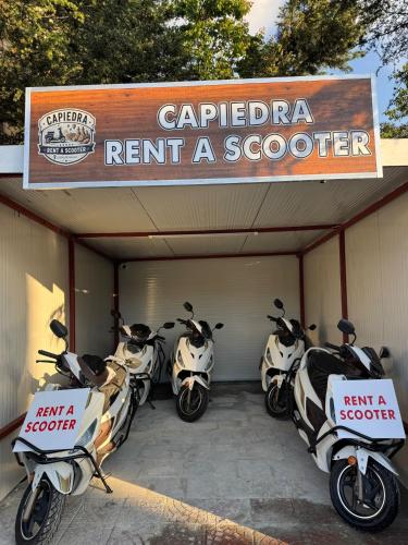 a row of motorcycles parked in a garage at Capiedra Hotel in Uçhisar