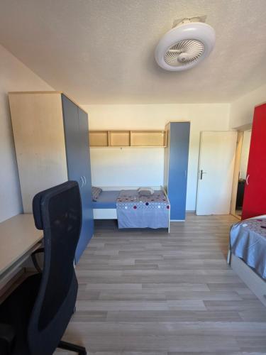 a room with a bedroom with a desk and a bed at Apartman Andrej in Povlja