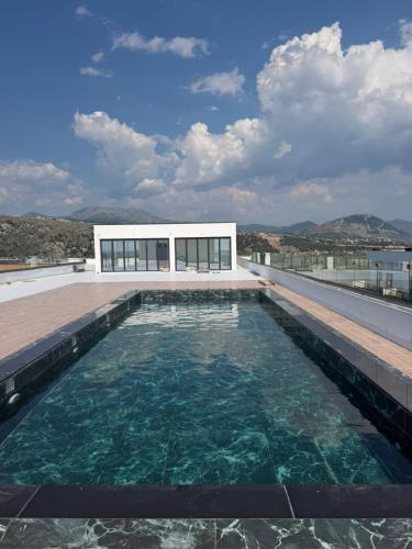 a swimming pool on the roof of a house at Royal Luxury Apartaments in Lezhë