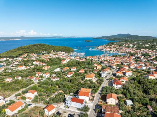 an aerial view of a small town next to the ocean at Villa Bosotina Royal Sea View in Kukljica