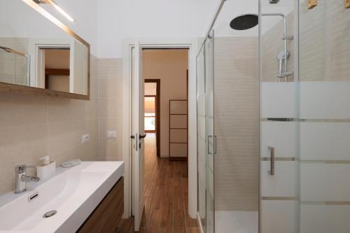 a bathroom with a sink and a shower at ArticOstia in Lido di Ostia