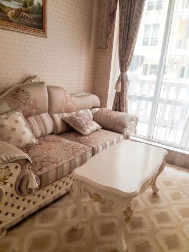 a living room with a couch and a table at Coastal Studio with Sea View in Elenite, 40m² + Pool in Elenite
