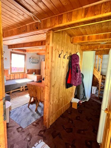 an inside view of a wooden cabin with a desk at Chata u řeky Svatavy in Josefov