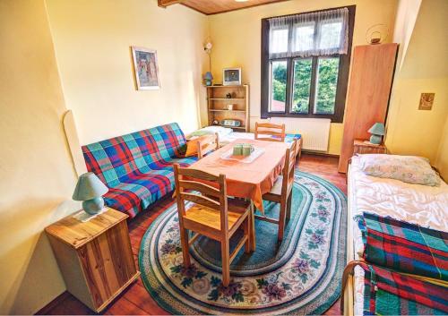 a living room with a table and a couch at Willa Świt in Maków Podhalański