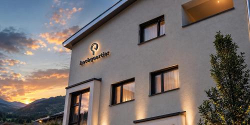 a building with a sign on the side of it at Mountain Inn - Hochquartier - Wildschönau in Niederau