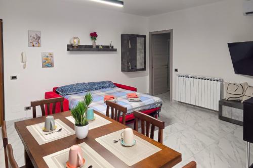 a living room with a table and a couch at Ca' di Sara in Domodossola