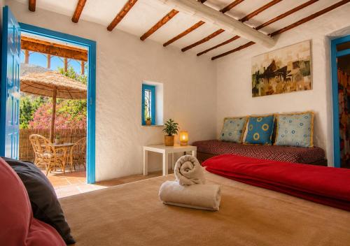 a living room with a couch and a table at Caiat Lounge Refuge , Mountain Lodge near Akchour Waterfalls in Taghzoute