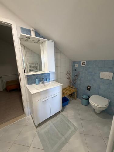a bathroom with a sink and a toilet at Villa Fragola in Doli