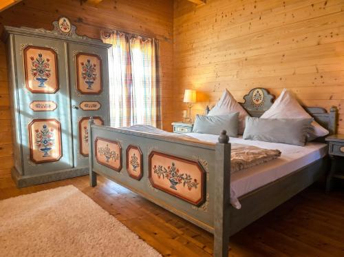 a bedroom with a bed in a wooden room at Ferienhaus John in Saarwellingen