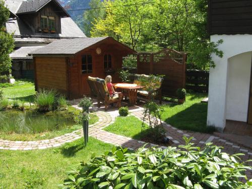 a backyard with a table and a gazebo at Apartment Silvia Cijan in Hallstatt