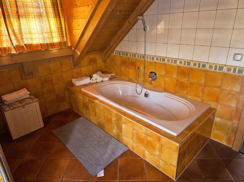 a bathroom with a large tub in a room at Ferienhaus John in Saarwellingen