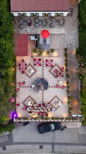 an overhead view of a patio with tables and chairs at Bed & Breakfast Villa Terezija in Baška