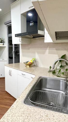 a kitchen with a sink and a counter top at Casa Zo an entire fully furnished apartment in Āīzawl