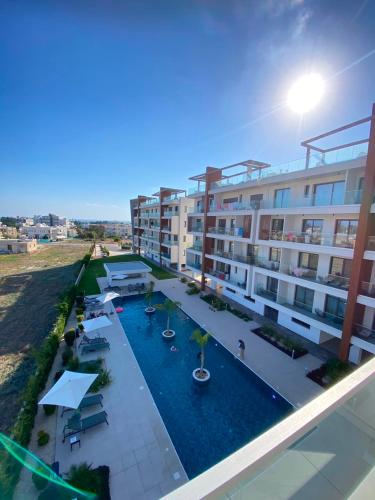 an overhead view of an apartment complex with a swimming pool at Sea view Penthouse Universal Residences in Paphos
