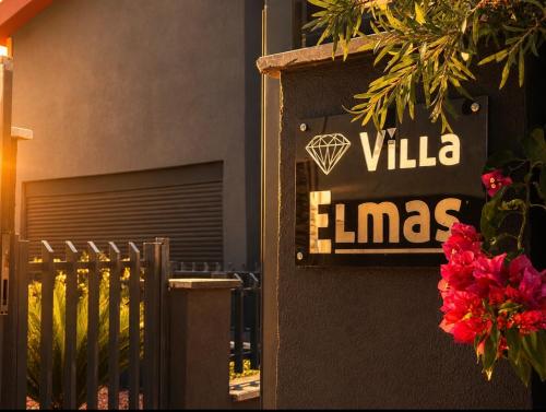 a sign that says villa limas on the side of a building at Villa Elmas in Kalkan