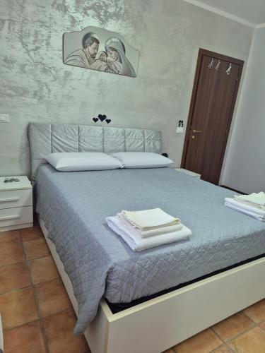a bedroom with a bed with towels on it at Castello Vignola in Vignola