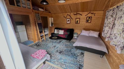 a small room with a bed and a couch at Välgi Puhkepesa in Välgi
