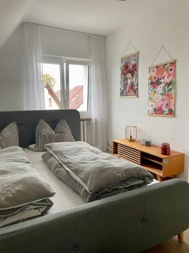a bed with two pillows on it in a bedroom at Ferienhaus L45 in Elsterheide