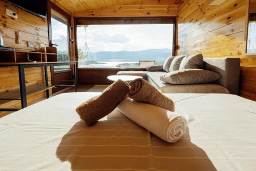 a bedroom with two beds and a large window at Lenka & Anika in Nikšić