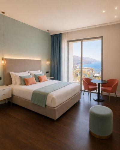 a bedroom with a large bed and a large window at Amaurusa Boutique Hotel in Taormina