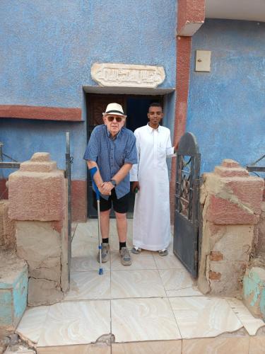 two men are standing in front of a building at Abo Orabi Guest House in Aswan