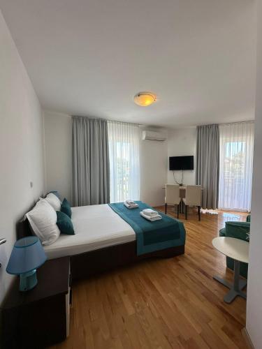 a bedroom with a large bed in a room at LotusApart in Premantura